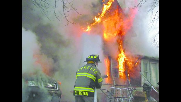 Several fire departments responded to a structure fire at Ricketts on Nov. 20 at 7:58 a.m., including Ricketts, Denison, Charter Oak and Schleswig. Firefighters were ordered out of the house after it was reported weapons and ammunition were in the home. Photo by Jim Clark.