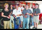 LODD Team members are pictured with Loretta McDowell Miletta Vista Winery holding Heroes series wine. Pictured from left to right are: Loretta McDowell, Roseanne Scurto, Ron Tubbs, Terry Zwiebel, Toby Watts, Fred Benzel, Casey Ryan and Mikey Eytcheson. 	